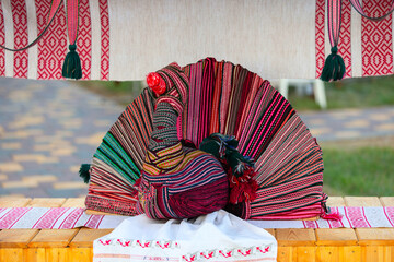 Traditional artisan craft of a decorated textile bird on display in a cultural market setting