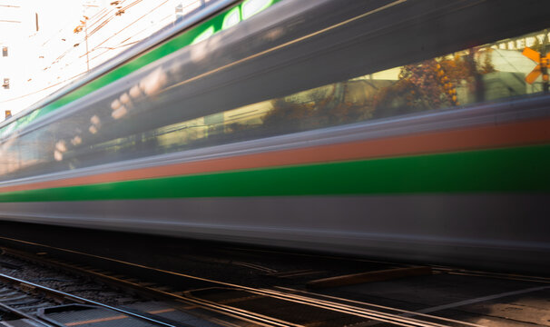 Blurred Train Passing Through Tokyo, Japan