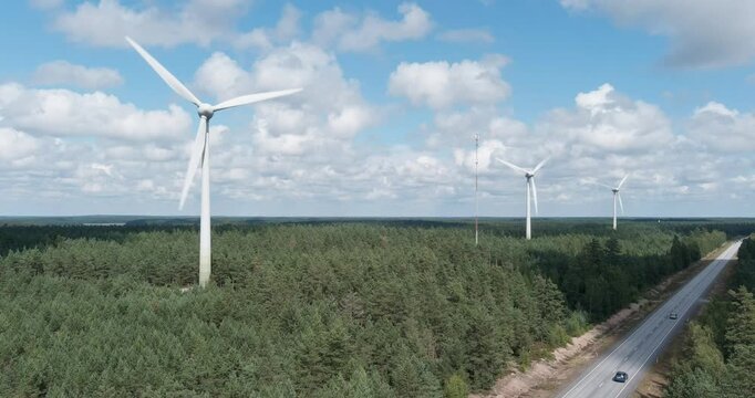 Aerial of wind farm.
Aerial view of wind farm located in a forested area in summer with clouds in the sky, Santala, Hanko, Finland.

