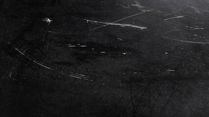 Fototapeta premium Black abstract grunge texture with dirty dust and noise effect. Rough dark background with scratches and aged overlay. White scratches and dust particles scattered on black surface.