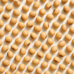 Golden-yellow soybeans on white surface