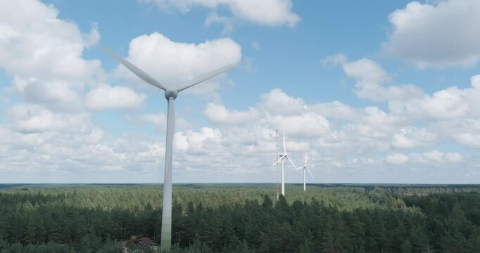 Aerial of wind farm.
Aerial view of wind farm located in a forested area in summer with clouds in the sky, Santala, Hanko, Finland.
