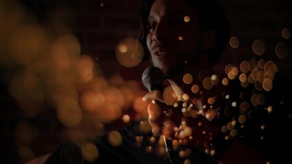 Golden particles drifting hiding stage while unveiling performer singing into microphone for music - Powered by Adobe