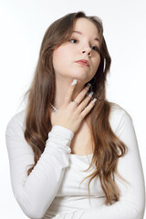Portrait of a beautiful young girl wearing pearl jewelry