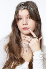 Portrait of a beautiful young girl wearing pearl jewelry