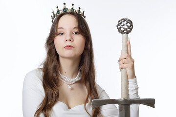 Portrait of a beautiful young princess girl with a sword