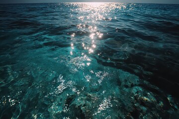 Sunlight Reflecting on Blue Ocean Water Surface on a Bright Sunny Day with Gentle Waves and Ripples Creating a Sparkling Effect in a Serene Seascape