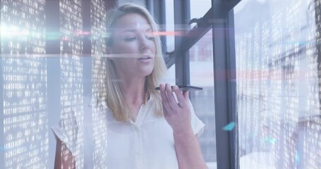 Animation of data processing over caucasian businesswoman using smartphone in office - Powered by Adobe