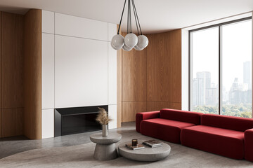 Naklejka premium Modern interior design living room with red sofa, wooden panels, minimalist fireplace, concrete tables, and large city view window. 3D Rendering. 3D Rendering