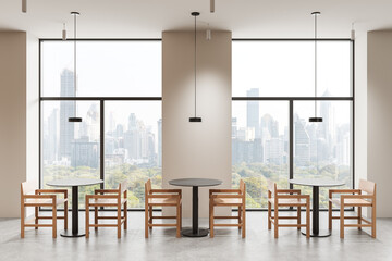 Modern interior design of dining area with wooden chairs and round tables near large windows...