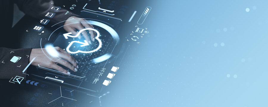 Cloud storage concept with hands on keyboard and digital data transfer graphics on blue background, representing global digital file services. - Powered by Adobe