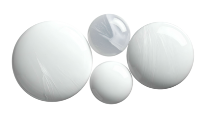 Four opaque spheres, white and gray, floating on a black background, with texture