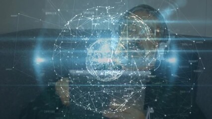 Man wearing hoodie and headset tapping smartphone screen on sofa, activating digital network globe - Powered by Adobe