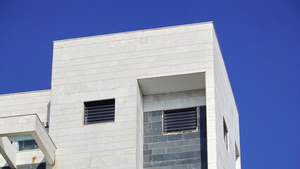 Modern Building Minimalist Architecture Low Angle View. White Blue Color Exterior
