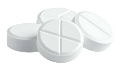 Close-up of four white, round pills with a cross-shaped score, isolated on black