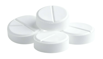 Stacked white, round tablets with scored lines, isolated on black