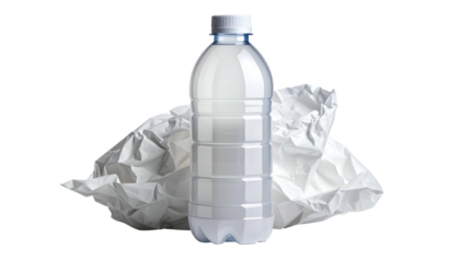 A transparent water bottle standing next to a crumpled ball of white paper against black