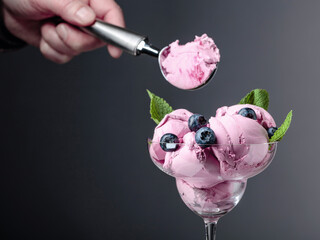 Blueberry ice cream with berries and mint.