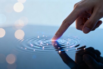 Finger touching water creating ripples