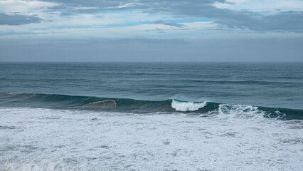 Fototapeta premium the biggest swell of the year hitting the coast line near Imsouane, Morocco wit +10m wave smashing into the rocks and shooting spray 50m in the air.