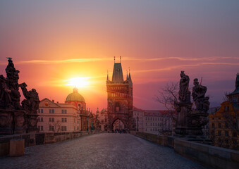 Naklejka premium View of Charles Bridge and Lesser Bridge Tower at sunset - Prague, Czech Republic