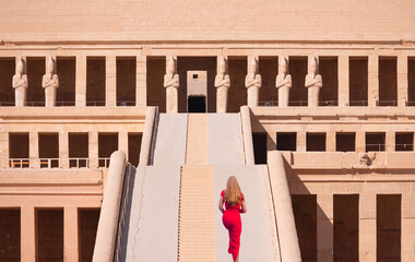 Hatshepsut Temple at sunrise in Valley of the Kings and red cliffs western bank of Nile river - Luxor- Egypt