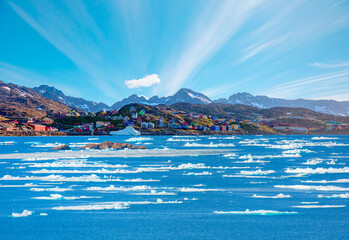 Picturesque village on coast of Greenland - Colorful houses in Tasiilaq, East Greenland