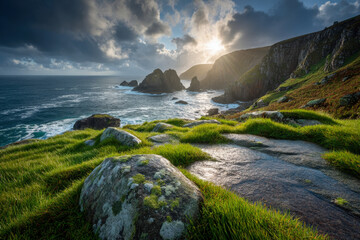 Obraz premium Coastal cliff viewpoint with wet rocks after rain and sun breaking through clouds