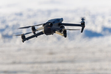 Camera drone flying over snowy landscape close up