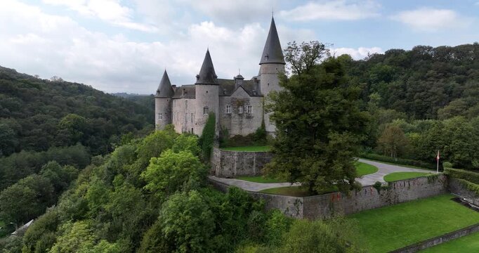 Veves castle aerial view overlooking forested valley