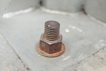 One bolt installed in the concrete surface