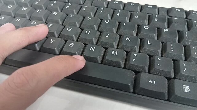 Pressing the space bar on the keyboard with your index finger