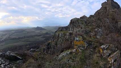 Fototapeta premium Ancient castle remains on rocky mountain peak in Czech landscape
