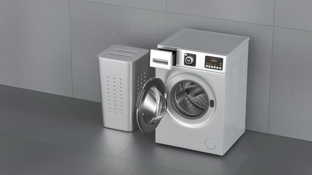 Modern silver front load washing machine and laundry hamper in laundry room