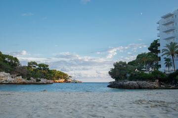 Empty Cala Ferrera beach in the evening panoramic view. Cala D'or on Mallorca in Spain.