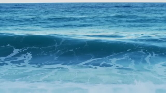 Serene ocean waves gently rolling towards the shore, a peaceful seascape video from a calm morning viewpoint.