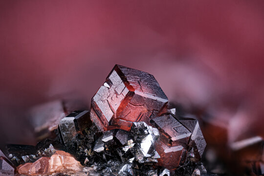 Andradite garnet on Manganite. Specimen from N'Chwaning II, South Africa. Micro photography extreme close-up. microscope mineral crystal photography for Scientific use.