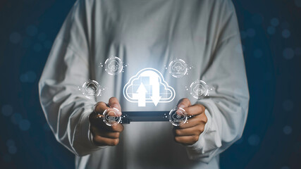 Cloud technology interface with upload and download icons illustrates digital data storage, business communication, and innovative database systems accessed through smart mobile devices.
