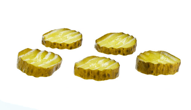 sliced marinated gherkins isolated on a white background.