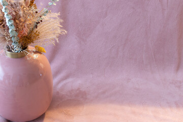 vase with flowers pink background