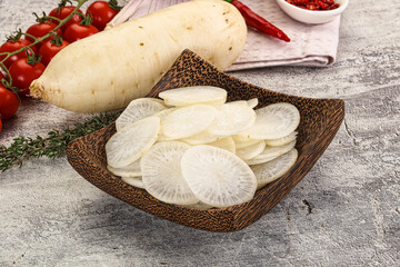 Sliced white daikon radish in the bowl