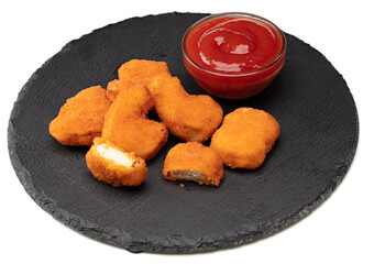 nuggets with ketchup on black plate isolated on white background. clipping path