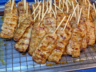  Grilled Thai pork skewers (Moo Ping) being sold at a local market. 