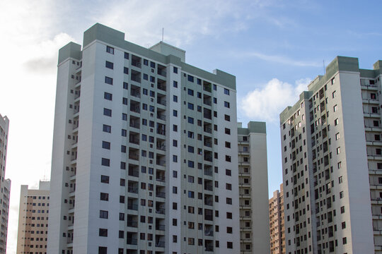 A collection of modern residential buildings in an urban area.