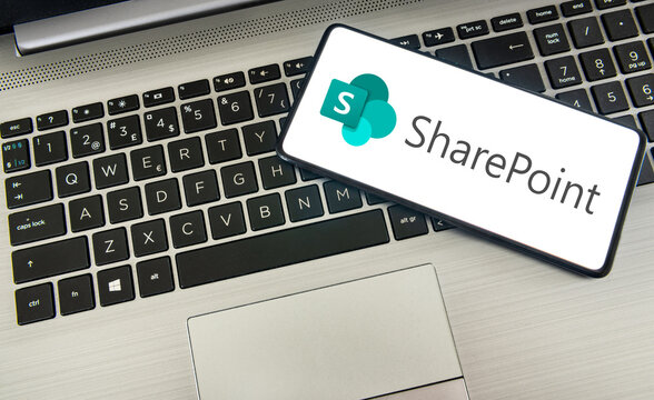 Microsoft Sharepoint logo on smartphone next to laptop. Link&ouml;ping, &Ouml;sterg&ouml;tland, Sweden. 01-18-2026