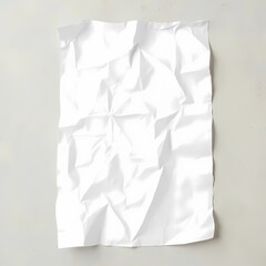 Crumpled white paper lays on a flat surface with a speckled design
