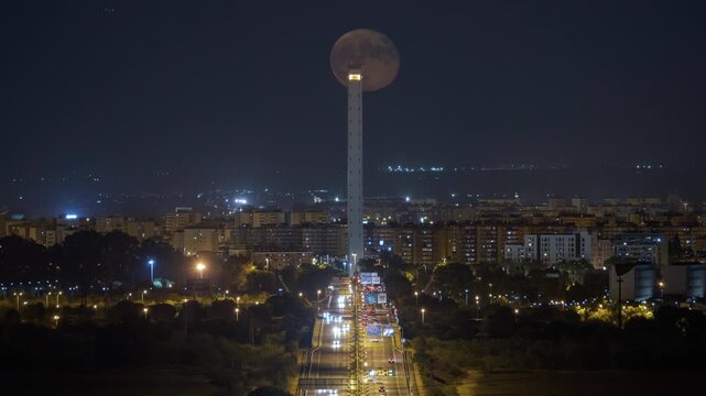 Timelapse of full moon crossing Alamillo Bridge in Seville
