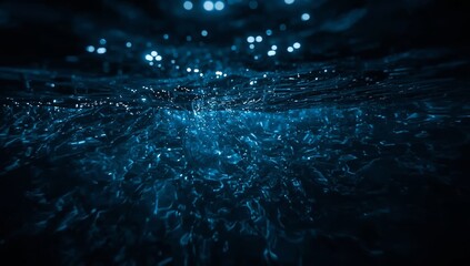 Water Surface Reflects Light in a Dark Underwater Scene Showing Movement and Texture