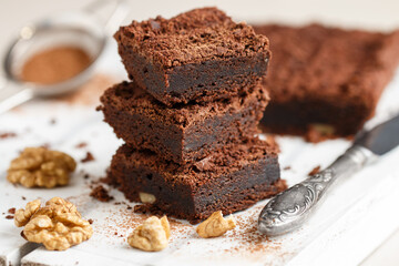 Homemade chocolate brownies with walnuts. Truffle pie. Delicious dessert close-up. Selective focus