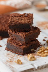 Homemade chocolate brownies with walnuts. Truffle pie. Delicious dessert close-up. Selective focus